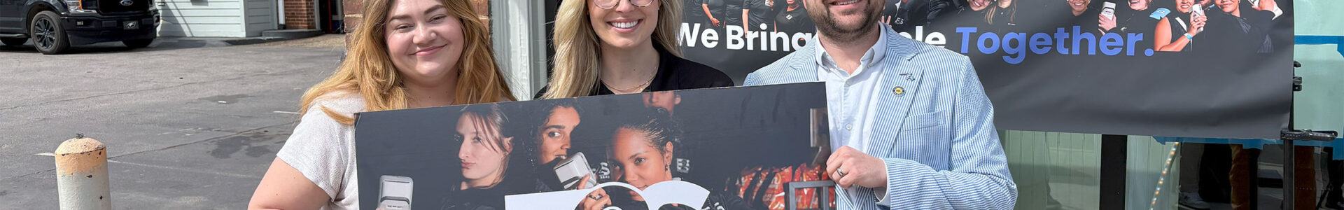 Sarah Potter (pictured right), the Town's Business Vitality Manager and David Putnam, the economic development director (pictured right) standing with the founder of Eats2Seats - a startup company located in Downtown.